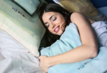 woman enjoying a good nights sleep