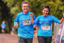 a couple running in a charity run