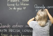 child looking at a blackboard learning a language