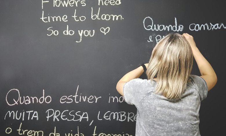 child looking at a blackboard learning a language