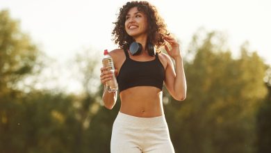 A happy woman outside exercising